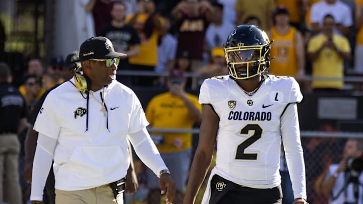 Colorado Buffaloes head coach Deion Sanders with son and quarterback Shedeur Sanders.