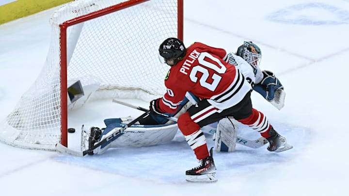 Jan 16, 2024; Chicago, Illinois, USA; Chicago Blackhawks center Rem Pitlick (20) scores past San