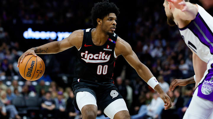 Mar 27, 2025; Sacramento, California, USA; Portland Trail Blazers guard Scoot Henderson (00) dribbles against Sacramento Kings forward Domantas Sabonis (11) during the third quarter at Golden 1 Center. Mandatory Credit: Sergio Estrada-Imagn Images Mar 27, 2025; Sacramento, California, USA; Portland Trail Blazers guard Scoot Henderson (00) dribbles against Sacramento Kings forward Domantas Sabonis (11) during the third quarter at Golden 1 Center. Mandatory Credit: Sergio Estrada-Imagn Images