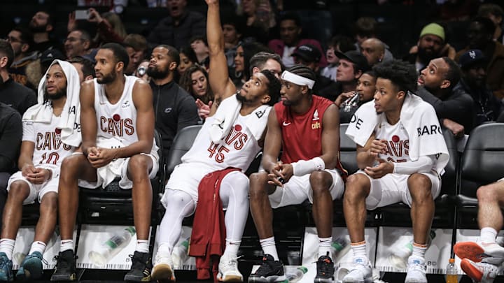 Feb 8, 2024; Brooklyn, New York, USA; Cleveland Cavaliers guard Donovan Mitchell (45) celebrates on the bench in the fourth quarter against the Brooklyn Nets at Barclays Center. Mandatory Credit: Wendell Cruz-Imagn Images