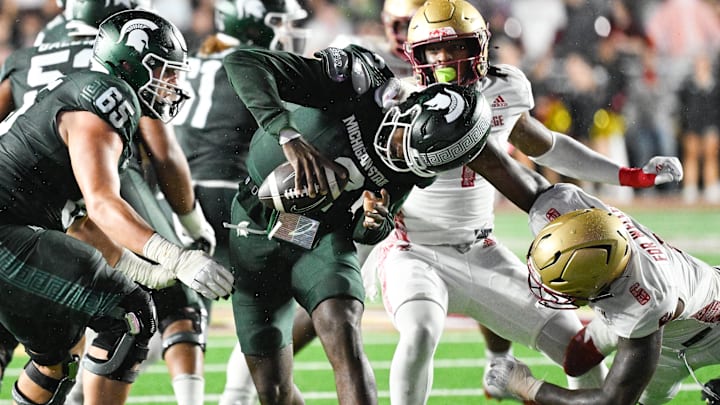 Sep 21, 2024; Chestnut Hill, Massachusetts, USA; Michigan State Spartans quarterback Aidan Chiles (2) is sacked by Boston College Eagles defensive end Donovan Ezeiruaku (6) during the second half at Alumni Stadium. Mandatory Credit: Eric Canha-Imagn Images