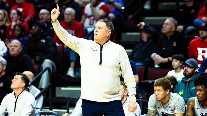 Penn State Nittany Lions basketball coach Mike Rhoades calls out a play to his team against the Rutgers Scarlet Knights. Penn State Nittany Lions basketball coach Mike Rhoades calls out a play to his team against the Rutgers Scarlet Knights.