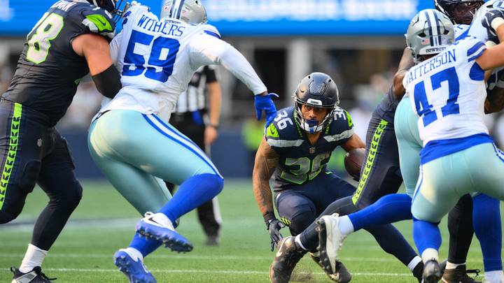 Seattle Seahawks running back George Holani (36) carries the ball against the Dallas Cowboys during the first half at Lumen Field. Seattle Seahawks running back George Holani (36) carries the ball against the Dallas Cowboys during the first half at Lumen Field.
