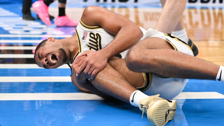 Purdue Boilermakers guard C.J. Cox (0) reacts to an injury. Purdue Boilermakers guard C.J. Cox (0) reacts to an injury.