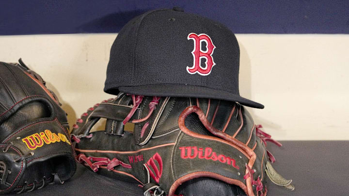 May 27, 2025; Milwaukee, Wisconsin, USA; A Boston Red Sox hat and glove sit in the dug out before a game against the Milwaukee Brewers at American Family Field. Mandatory Credit: Michael McLoone-Imagn Images May 27, 2025; Milwaukee, Wisconsin, USA; A Boston Red Sox hat and glove sit in the dug out before a game against the Milwaukee Brewers at American Family Field. Mandatory Credit: Michael McLoone-Imagn Images
