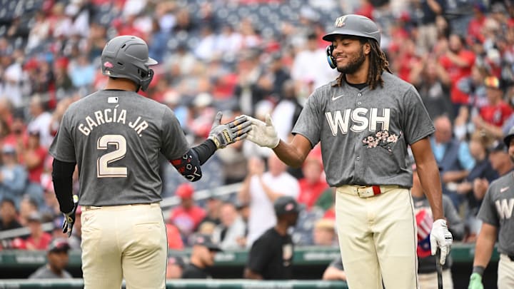 Sep 29, 2024; Washington, District of Columbia, USA; Washington Nationals second baseman Luis Garcia Jr. (2) celebrates at home plate with left fielder James Wood (29) after hitting a home run against the Philadelphia Phillies during the first inning at Nationals Park. 