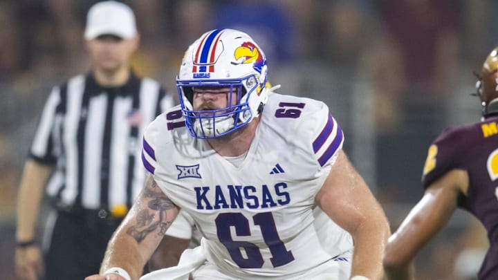 Oct 5, 2024; Tempe, Arizona, USA; Kansas Jayhawks offensive lineman Bryce Foster (61) against the Arizona State Sun Devils at Mountain America Stadium. Mandatory Credit: Mark J. Rebilas-Imagn Images
