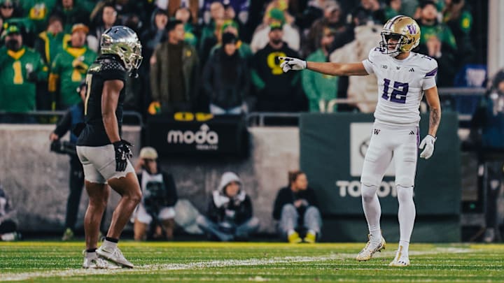 Denzel Boston gives pointers at Oregon. 