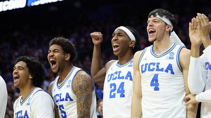 Mar 20, 2026; Philadelphia, PA, USA; UCLA Bruins guard Skyy Clark (55), guard Brandon Williams (5), center Steven Jamerson II (24), and guard Jamar Brown (4) react on the bench in the second half during a first round game of the men's 2026 NCAA Tournament at Xfinity Mobile Arena. Mandatory Credit: Bill Streicher-Imagn Images Mar 20, 2026; Philadelphia, PA, USA; UCLA Bruins guard Skyy Clark (55), guard Brandon Williams (5), center Steven Jamerson II (24), and guard Jamar Brown (4) react on the bench in the second half during a first round game of the men's 2026 NCAA Tournament at Xfinity Mobile Arena. Mandatory Credit: Bill Streicher-Imagn Images