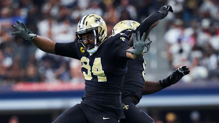 Sep 15, 2024; Arlington, Texas, USA; New Orleans Saints defensive end Carl Granderson (96) celebrates with New Orleans Saints defensive end Cameron Jordan (94) during the second half against the Dallas Cowboys at AT&T Stadium. Mandatory Credit: Kevin Jairaj-Imagn Images Sep 15, 2024; Arlington, Texas, USA; New Orleans Saints defensive end Carl Granderson (96) celebrates with New Orleans Saints defensive end Cameron Jordan (94) during the second half against the Dallas Cowboys at AT&T Stadium. Mandatory Credit: Kevin Jairaj-Imagn Images