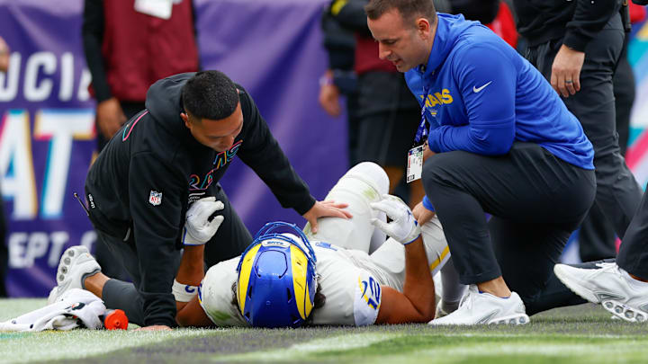Oct 12, 2025; Baltimore, Maryland, USA; Los Angeles Rams wide receiver Puka Nacua (12) is checked on by trainers during the second quarter of the game against the Baltimore Ravens at M&T Bank Stadium. Mandatory Credit: Peter Casey-Imagn Images Oct 12, 2025; Baltimore, Maryland, USA; Los Angeles Rams wide receiver Puka Nacua (12) is checked on by trainers during the second quarter of the game against the Baltimore Ravens at M&T Bank Stadium. Mandatory Credit: Peter Casey-Imagn Images