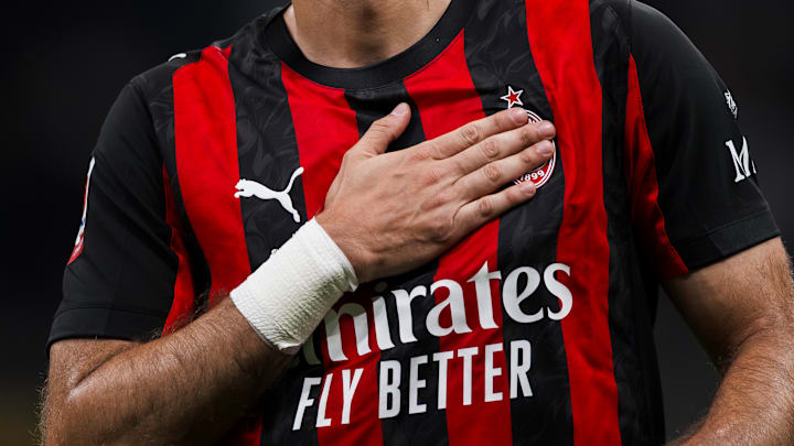 Santiago Gimenez of AC Milan taps his chest and the club... Santiago Gimenez of AC Milan taps his chest and the club...