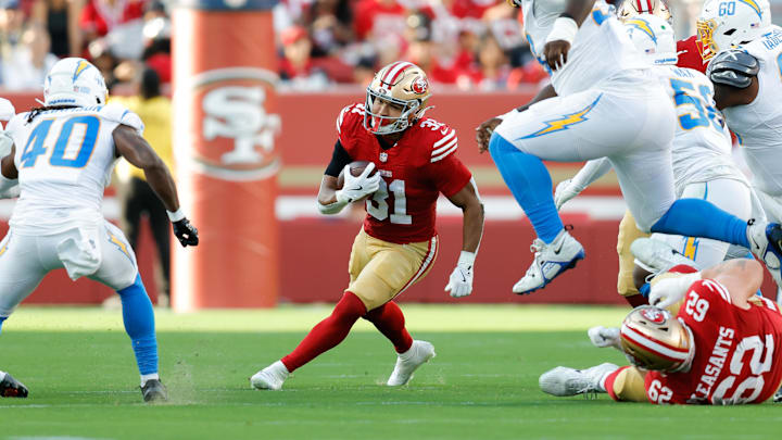 Aug 23, 2025; Santa Clara, California, USA; San Francisco 49ers running back Isaac Guerendo (31) runs with the ball during the second quarter against the Los Angeles Chargers at Levi's Stadium. Mandatory Credit: Sergio Estrada-Imagn Images Aug 23, 2025; Santa Clara, California, USA; San Francisco 49ers running back Isaac Guerendo (31) runs with the ball during the second quarter against the Los Angeles Chargers at Levi's Stadium. Mandatory Credit: Sergio Estrada-Imagn Images