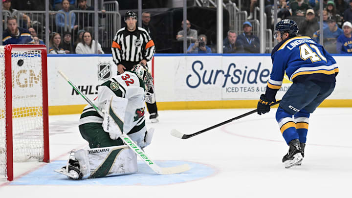Apr 13, 2026; St. Louis, Missouri, USA; St. Louis Blues defenseman Theo Lindstein (41) scores a goal past Minnesota Wild goaltender Filip Gustavsson (32) in the second period at Enterprise Center. Mandatory Credit: Joe Puetz-Imagn Images