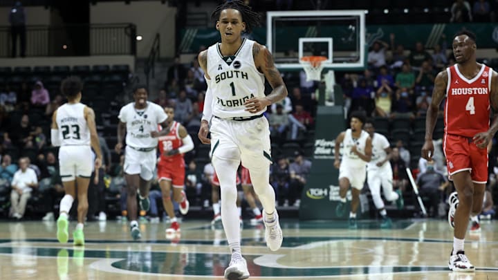 Jan 5, 2022; Tampa, Florida, USA; South Florida Bulls guard Javon Greene (1) celebrate as he makes a three pointer during the second half against the Houston Cougars at Yuengling Center. Mandatory Credit: Kim Klement-USA TODAY Sports