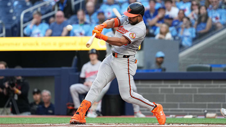 Aug 7, 2024; Toronto, Ontario, CAN; Baltimore Orioles right fielder Anthony Santander (25) hits a two run home run against the Toronto Blue Jays during the first inning at Rogers Centre.