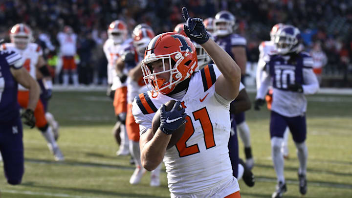 Nov 30, 2024; Chicago, Illinois, USA; Illinois Fighting Illini running back Aidan Laughery (21) runs for a touchdown against Northwestern Wildcats during the first half at Wrigley Field. Mandatory Credit: Matt Marton-Imagn Images Nov 30, 2024; Chicago, Illinois, USA; Illinois Fighting Illini running back Aidan Laughery (21) runs for a touchdown against Northwestern Wildcats during the first half at Wrigley Field. Mandatory Credit: Matt Marton-Imagn Images