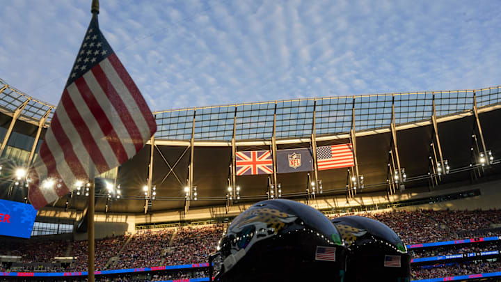 Oct 8, 2023; London, United Kingdom;  Flags and helmets in the evening sun during the second half of an NFL International Series game at Tottenham Hotspur Stadium. Mandatory Credit: Peter van den Berg-USA TODAY Sports
