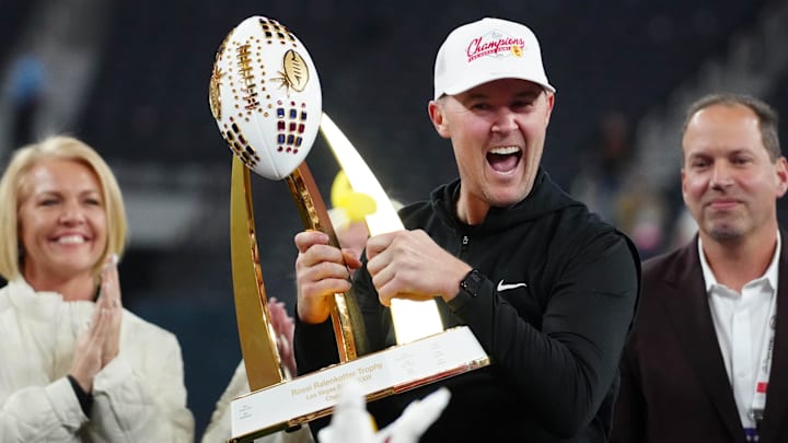 Dec 27, 2024; Las Vegas, NV, USA; Southern California Trojans head coach Lincoln Riley holds the championship trophy after the game against the Texas A&M Aggies at Allegiant Stadium. 