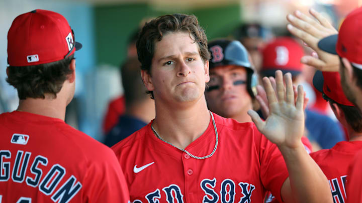Feb 28, 2025; Clearwater, Florida, USA; Boston Red Sox outfielder Roman Anthony (48) is congratulated after he scored a run against the Philadelphia Phillies  during the third inning  at BayCare Ballpark. Mandatory Credit: Kim Klement Neitzel-Imagn Images