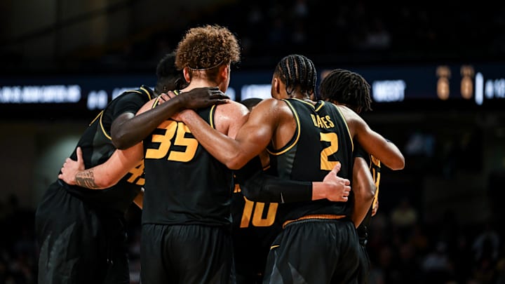 A group of Missouri Tigers huddle during a game last season.