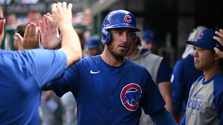 Sep 1, 2024; Washington, District of Columbia, USA; Chicago Cubs center fielder Cody Bellinger (24) celebrates in the dugout after scoring a run against the Washington Nationals during the seventh inning at Nationals Park.