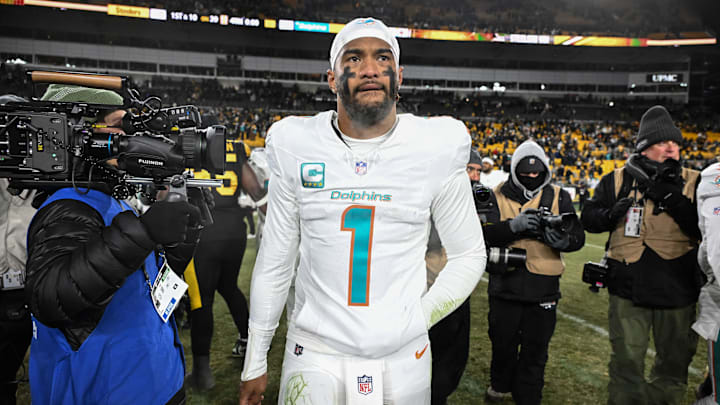 Dec 15, 2025; Pittsburgh, Pennsylvania, USA; Miami Dolphins quarterback Tua Tagovailoa (1) leaves the  field following a game against the Pittsburgh Steelers at Acrisure Stadium. Mandatory Credit: Barry Reeger-Imagn Images