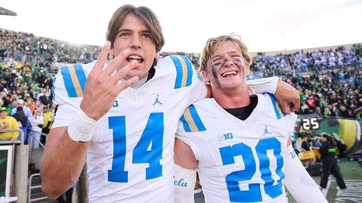 UCLA Bruins quarterback Ty Dieffenbach (14) celebrates with linebacker Scott Taylor (20) UCLA Bruins quarterback Ty Dieffenbach (14) celebrates with linebacker Scott Taylor (20)