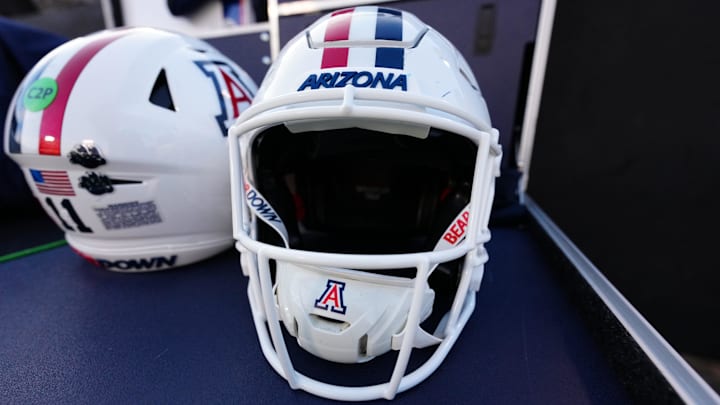 Nov 1, 2025; Boulder, Colorado, USA; General view of Arizona Wildcats helmets before the game against the Colorado Buffaloes at Folsom Field. Mandatory Credit: Ron Chenoy-Imagn Images