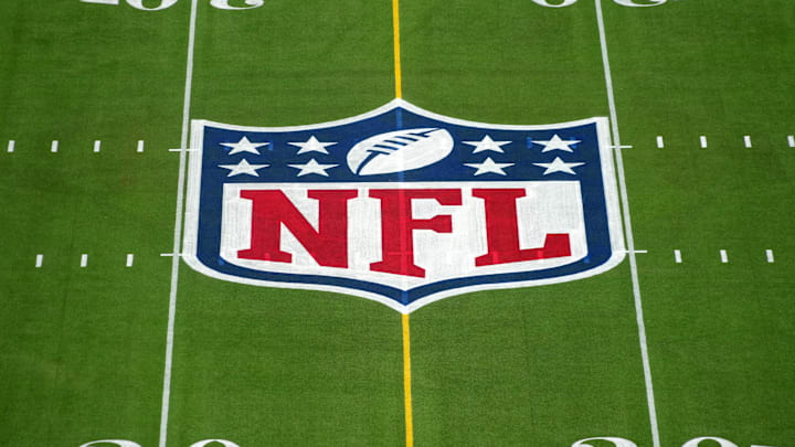 Feb 1, 2025; Orlando, FL, USA; An overall view of the NFL shield logo at midfield on the Camping World Stadium flag football field.