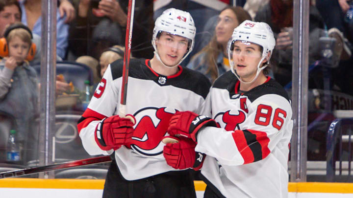 Feb 13, 2024; Nashville, Tennessee, USA; New Jersey Devils defenseman Luke Hughes (43) celebrates the goal of center Jack Hughes (86) against the Nashville Predators during the second period at Bridgestone Arena. Mandatory Credit: Steve Roberts-Imagn Images Feb 13, 2024; Nashville, Tennessee, USA; New Jersey Devils defenseman Luke Hughes (43) celebrates the goal of center Jack Hughes (86) against the Nashville Predators during the second period at Bridgestone Arena. Mandatory Credit: Steve Roberts-Imagn Images