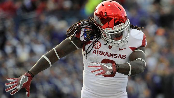 Arkansas Razorbacks running back Alex Collins (3) celebrates in the end zone against the Kansas State Wildcats during the first half at Liberty Bowl. Arkansas Razorbacks running back Alex Collins (3) celebrates in the end zone against the Kansas State Wildcats during the first half at Liberty Bowl.