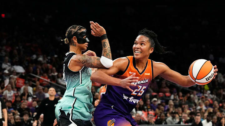 New York Liberty guard Natasha Cloud (9) pressures Phoenix Mercury forward Alyssa Thomas (25) in the first half during Game Three of the 2025 WNBA Playoffs first round at PHX Arena on Sept. 19, 2025, in Phoenix.