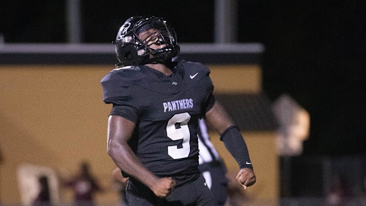 Kaedan Barnes (9) celebrates scoring a touchdown and taking a 6-0 Panthers lead during the Pensacola vs Milton football game at Milton High School on Thursday, Aug. 29, 2024.