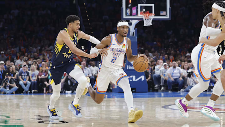 Mar 29, 2025; Oklahoma City, Oklahoma, USA; Oklahoma City Thunder guard Shai Gilgeous-Alexander (2) drives to the basket beside Indiana Pacers guard Tyrese Haliburton (0) during the second quarter at Paycom Center. Mandatory Credit: Alonzo Adams-Imagn Images Mar 29, 2025; Oklahoma City, Oklahoma, USA; Oklahoma City Thunder guard Shai Gilgeous-Alexander (2) drives to the basket beside Indiana Pacers guard Tyrese Haliburton (0) during the second quarter at Paycom Center. Mandatory Credit: Alonzo Adams-Imagn Images