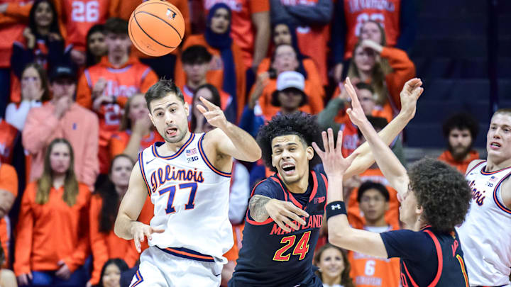 Jan 21, 2026; Champaign, Illinois, USA; Illinois Fighting Illini guard Mihailo Petrovic (77) passes the ball against Maryland Terrapins forward Aleks Alston (24) in the first half  at State Farm Center. Mandatory Credit: Fred Zwicky-Imagn Images