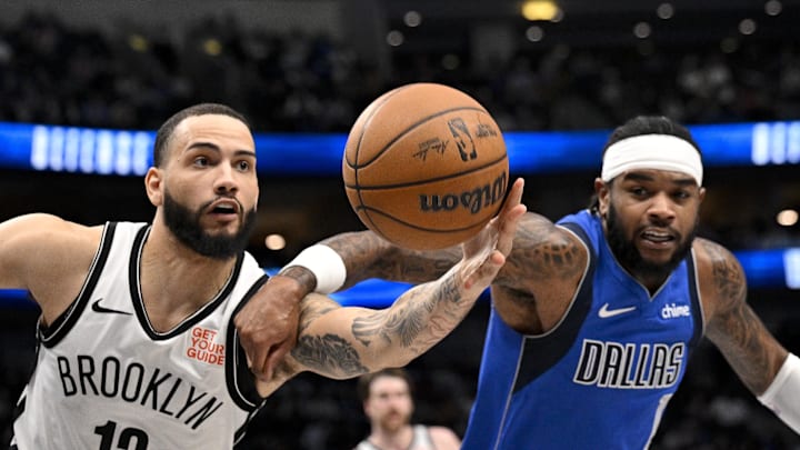 Mar 31, 2025; Dallas, Texas, USA; Brooklyn Nets guard Tyrese Martin (13) during the second half at the American Airlines Center. Mandatory Credit: and Dallas Mavericks guard Jaden Hardy (1) chase the loose ball Jerome Miron-Imagn Images