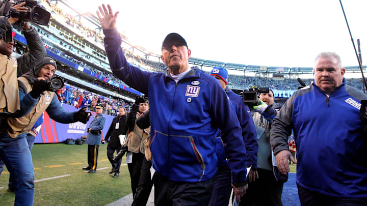 Jan 3, 2016; East Rutherford, NJ, USA; New York Giants head coach Tom Coughlin (C) waves to fans while walking off the field after the game against the Philadelphia Eagles at MetLife Stadium. The Eagles won 35-30. Jan 3, 2016; East Rutherford, NJ, USA; New York Giants head coach Tom Coughlin (C) waves to fans while walking off the field after the game against the Philadelphia Eagles at MetLife Stadium. The Eagles won 35-30.