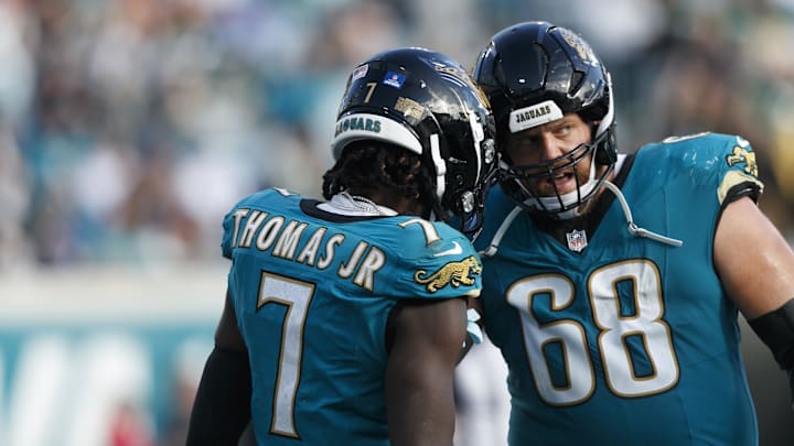 Dec 15, 2024; Jacksonville, Florida, USA; Jacksonville Jaguars wide receiver Brian Thomas Jr. (7) and offensive line Brandon Scherff (68) celebrate a touchdown against the New York Jets during the fourth quarter at EverBank Stadium. Mandatory Credit: Morgan Tencza-Imagn Images Dec 15, 2024; Jacksonville, Florida, USA; Jacksonville Jaguars wide receiver Brian Thomas Jr. (7) and offensive line Brandon Scherff (68) celebrate a touchdown against the New York Jets during the fourth quarter at EverBank Stadium. Mandatory Credit: Morgan Tencza-Imagn Images
