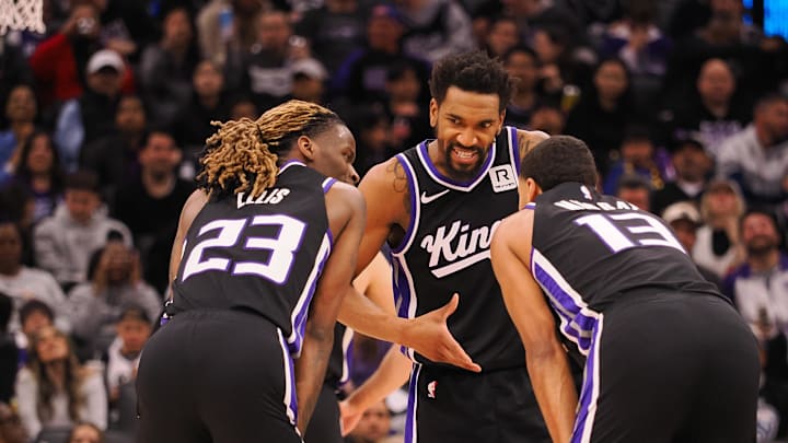Feb 8, 2025; Sacramento, California, USA; Sacramento Kings guard Malik Monk (0) speaks with teammates guard Keon Ellis (23) and forward Keegan Murray (13) between plays against the New Orleans Pelicans during the third quarter at Golden 1 Center. Mandatory Credit: Kelley L Cox-Imagn Images Feb 8, 2025; Sacramento, California, USA; Sacramento Kings guard Malik Monk (0) speaks with teammates guard Keon Ellis (23) and forward Keegan Murray (13) between plays against the New Orleans Pelicans during the third quarter at Golden 1 Center. Mandatory Credit: Kelley L Cox-Imagn Images