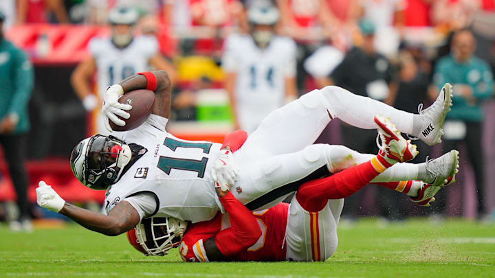 Sep 14, 2025; Kansas City, Missouri, USA; Kansas City Chiefs defensive tackle Omarr Norman-Lott (55) tackles Philadelphia Eagles wide receiver A.J. Brown (11) during the second quarter of the game at GEHA Field at Arrowhead Stadium. Mandatory Credit: Jay Biggerstaff-Imagn Images