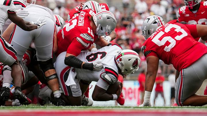 Ohio State Buckeyes defensive lineman Beau Atkinson (12) tackles Ball State Cardinals quarterback Keldric Luster (6) during the NCAA football game at Ohio Stadium in Columbus on Sept. 5, 2026. Ohio State won 56-3.