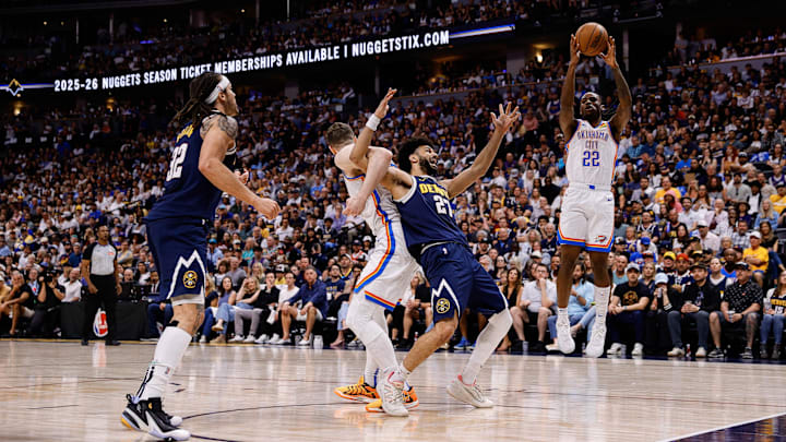 May 11, 2025; Denver, Colorado, USA; Oklahoma City Thunder guard Cason Wallace (22) grabs a rebound as Denver Nuggets guard Jamal Murray (27) is tied up with center Isaiah Hartenstein (55) as forward Aaron Gordon (32) defends in the second quarter during game four of the second round of the 2025 NBA Playoffs at Ball Arena. Mandatory Credit: Isaiah J. Downing-Imagn Images