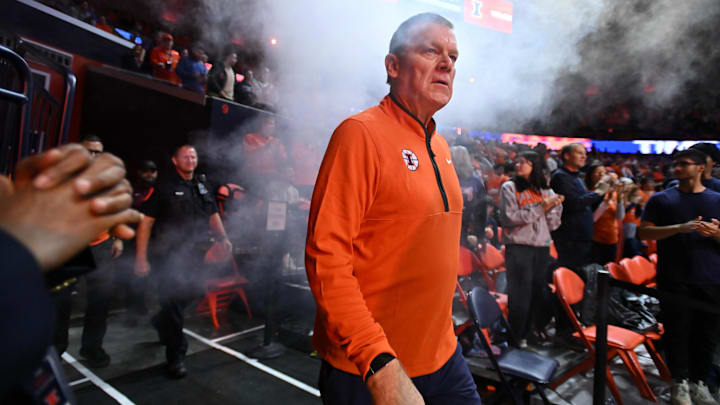 Nov 11, 2025; Champaign, Illinois, USA; Illinois Fighting Illini head coach Brad Underwood walks to the court before the game against the Texas Tech Red Raiders at State Farm Center. Mandatory Credit: Ron Johnson-Imagn Images