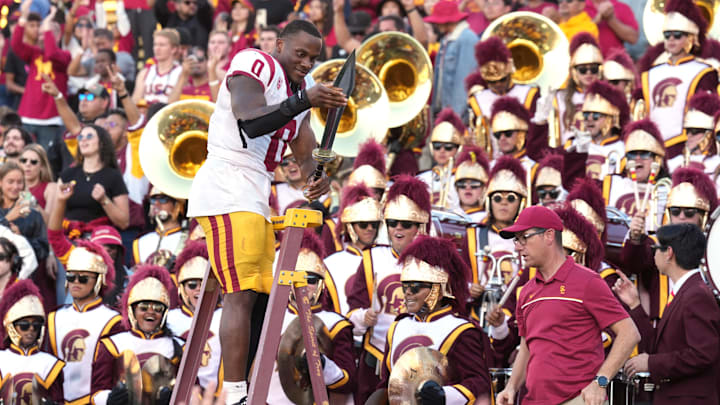 Oct 28, 2023; Berkeley, California, USA; USC Trojans running back MarShawn Lloyd (0) holds the Trojan sword after defeating the California Golden Bears at California Memorial Stadium. Mandatory Credit: Darren Yamashita-USA TODAY Sports