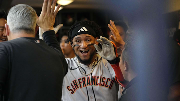 Aug 22, 2025; Milwaukee, Wisconsin, USA; San Francisco Giants outfielder Luis Matos (29) celebrates in the dug out after hitting a home run against the Milwaukee Brewers in the second inning at American Family Field. Mandatory Credit: Michael McLoone-Imagn Images