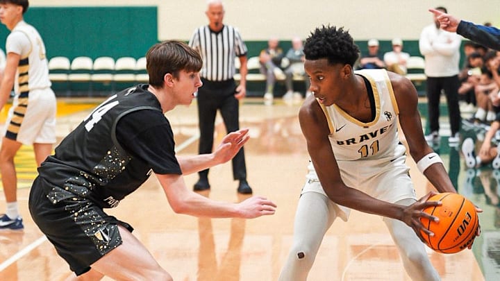 St. John Bosco forward Christian Collins (right) looks to score against Heritage Christian in the Classic at Damien.