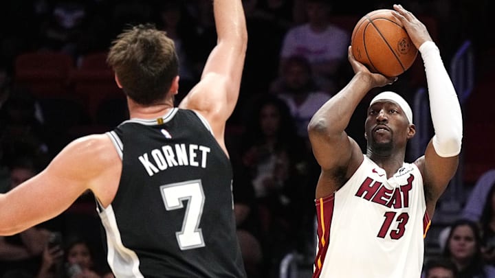 Oct 8, 2025; Miami, Florida, USA; Miami Heat center Bam Adebayo (13) takes a shot over San Antonio Spurs forward Luke Kornet (7) during the first half at Kaseya Center. Mandatory Credit: Jim Rassol-Imagn Images Oct 8, 2025; Miami, Florida, USA; Miami Heat center Bam Adebayo (13) takes a shot over San Antonio Spurs forward Luke Kornet (7) during the first half at Kaseya Center. Mandatory Credit: Jim Rassol-Imagn Images