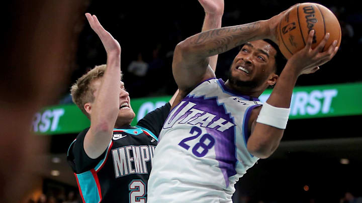 Feb 20, 2026; Memphis, Tennessee, USA; Utah Jazz forward Brice Sensabaugh (28) drives against Memphis Grizzlies guard Cam Spencer (24) during the third quarter at FedExForum. Mandatory Credit: Petre Thomas-Imagn Images Feb 20, 2026; Memphis, Tennessee, USA; Utah Jazz forward Brice Sensabaugh (28) drives against Memphis Grizzlies guard Cam Spencer (24) during the third quarter at FedExForum. Mandatory Credit: Petre Thomas-Imagn Images