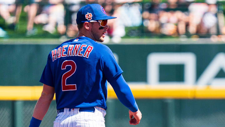 Mar 12, 2023; Mesa, Arizona, USA; Chicago Cubs infielder Nico Hoerner (2) watches on between pitches Mar 12, 2023; Mesa, Arizona, USA; Chicago Cubs infielder Nico Hoerner (2) watches on between pitches